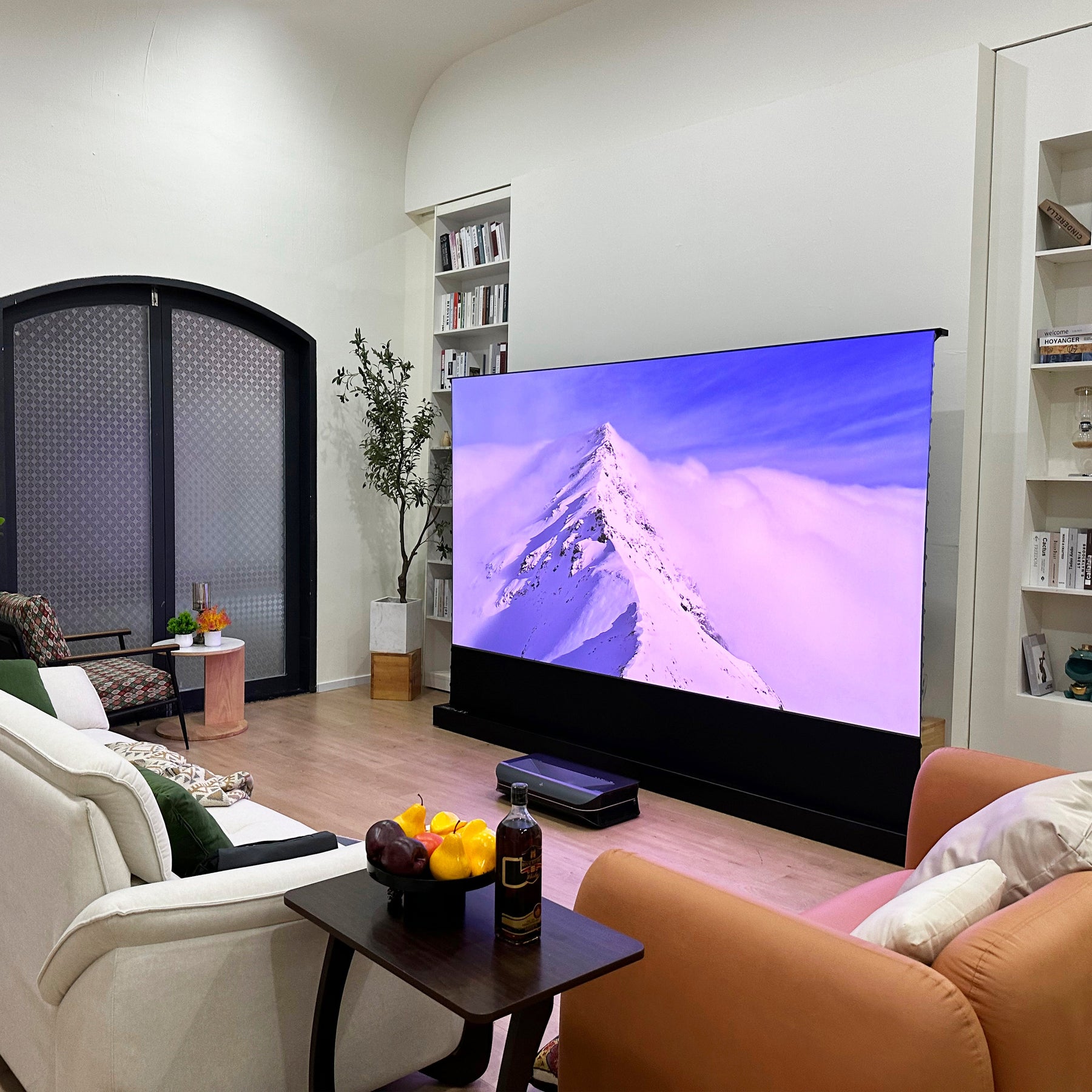 LTV-3500 Pro short throw TV projector and acoustic projector screen showing mountain view in home theater.