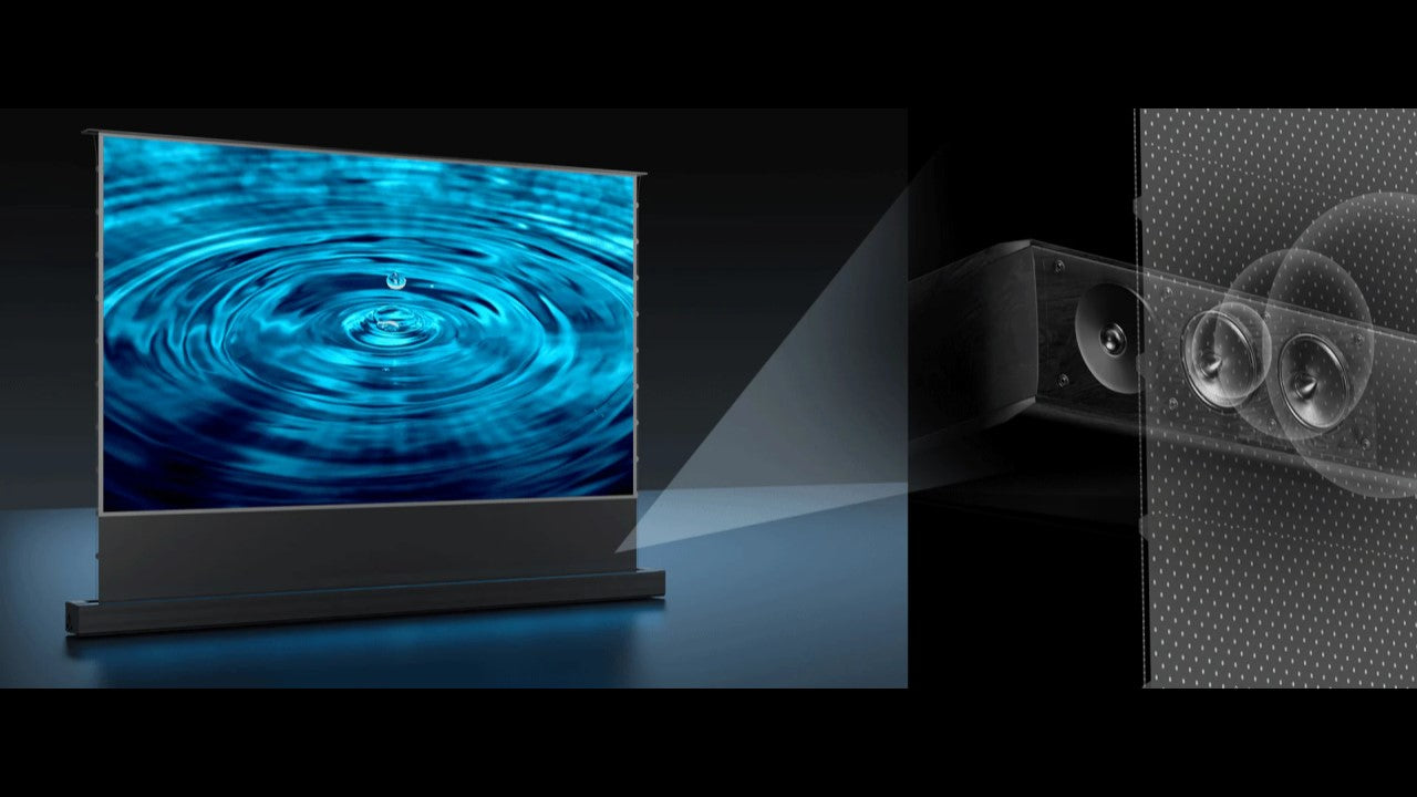 An acoustically transparent projector screen with speakers placed behind it shows how sound passes through perforations for an immersive home theater experience.