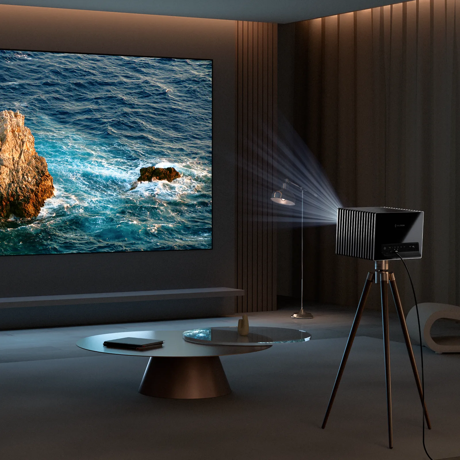 Valerion VisionMaster Pro2 4K HDR IMAX Enhanced long throw projector on tripod projecting a large image in a modern living room.