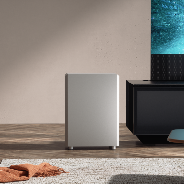 Close-up of AWOL Vision's sleek subwoofer, part of the best wireless surround sound system for home theaters.